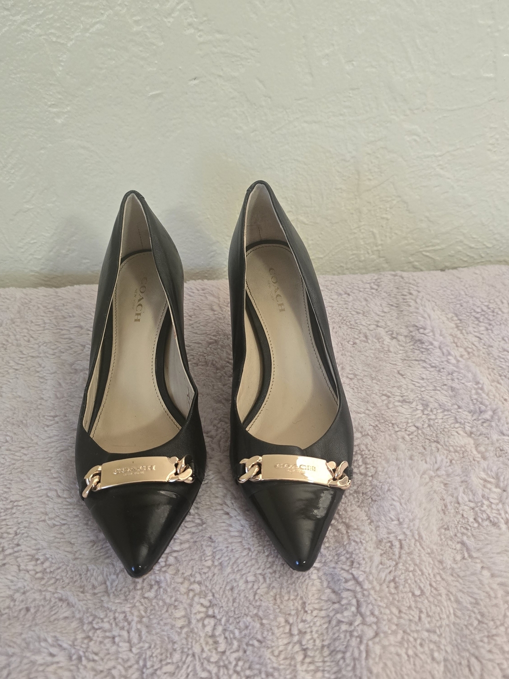 COACH Women's Black Pointed Toe Pumps with Gold Plaque